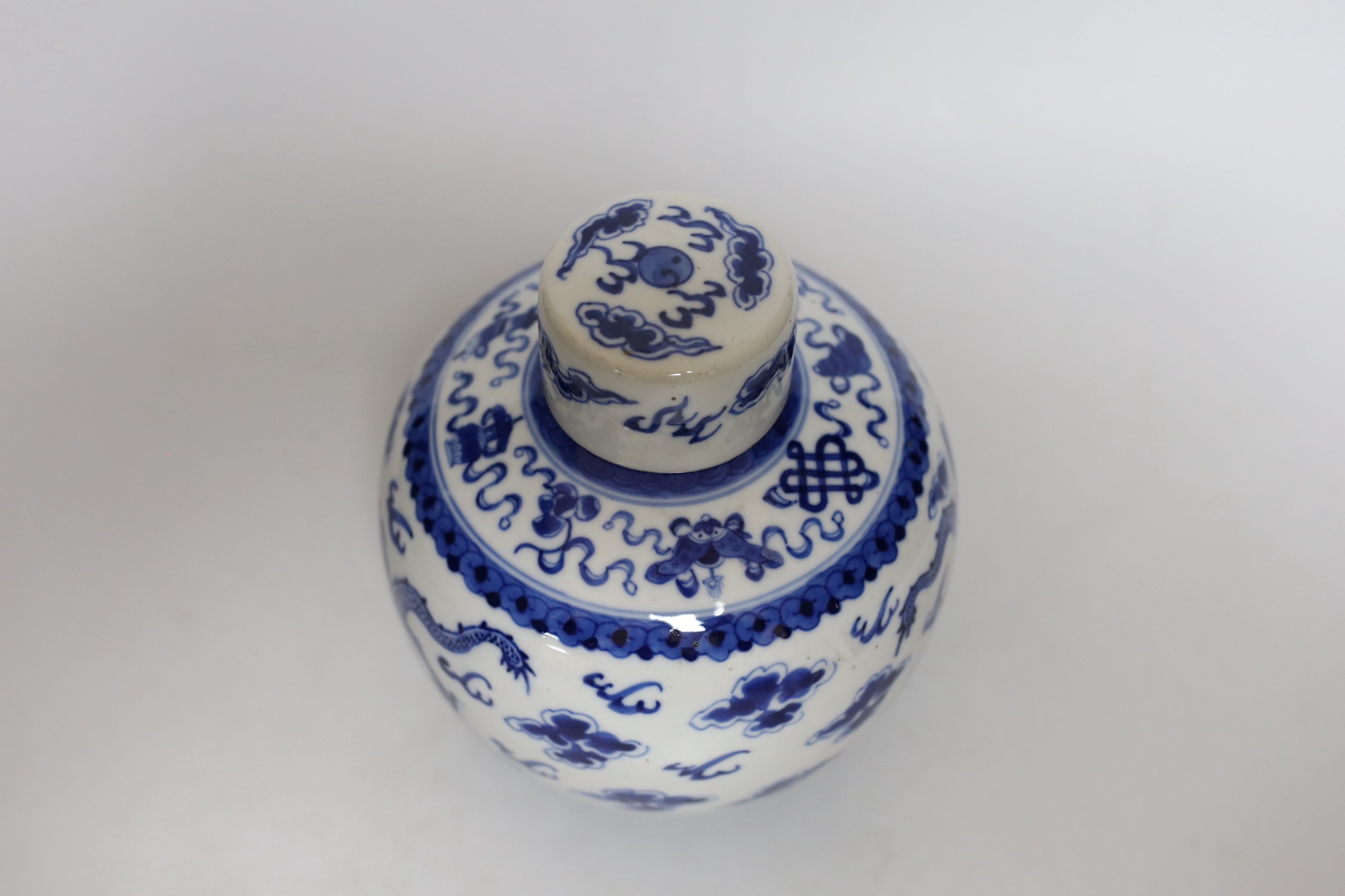 A Chinese blue and white ‘dragon’ jar and cover, 19th century, 18cm tall